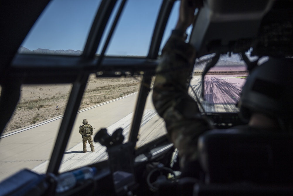 Fly Away Security Team Provides Security for a C-130 while Loading and Unloading Equipment