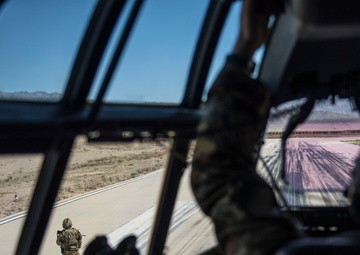 Fly Away Security Team Provides Security for a C-130 while Loading and Unloading Equipment