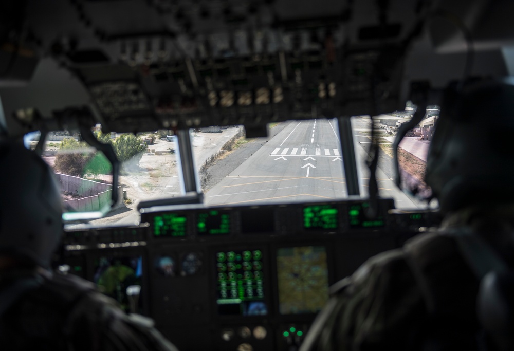 Fly Away Security Team Provides Security for a C-130 while Loading and Unloading Equipment