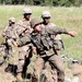 Polish Army soldier cross trains on grenade throwing with U.S. Army soldiers