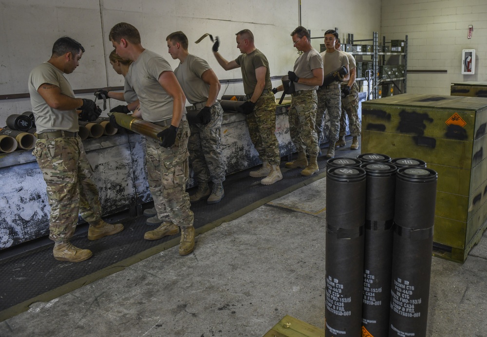 1st SOW commander builds 105mm rounds with Ammo Airmen