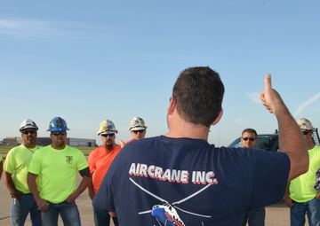 Helicopter moves 57 air conditioning units to roof of Bldg 3001.