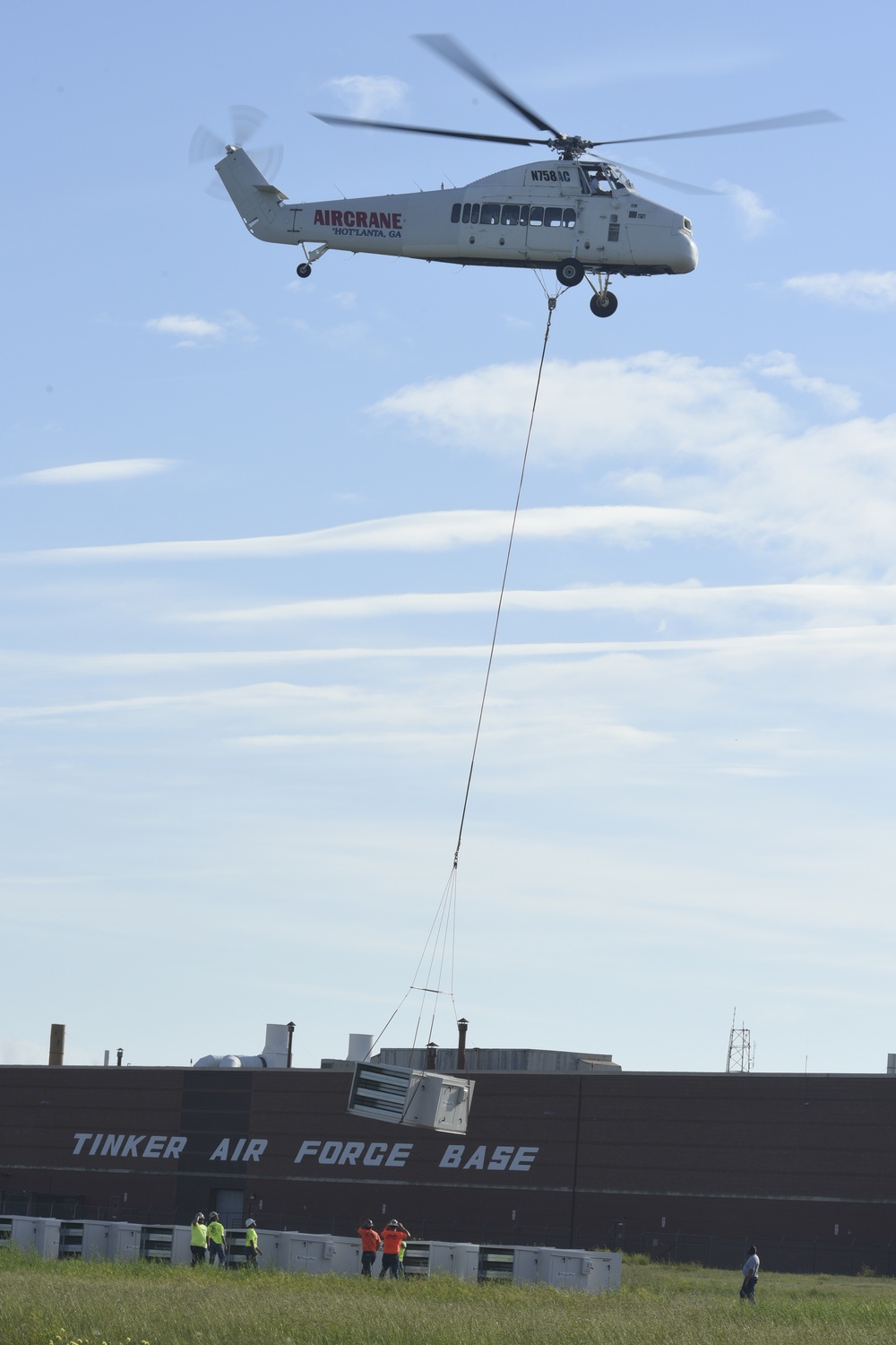 Helicopter moves 57 air conditioning units to roof of Bldg 3001.