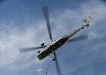 Helicopter moves 57 air conditioning units to roof of Bldg 3001.