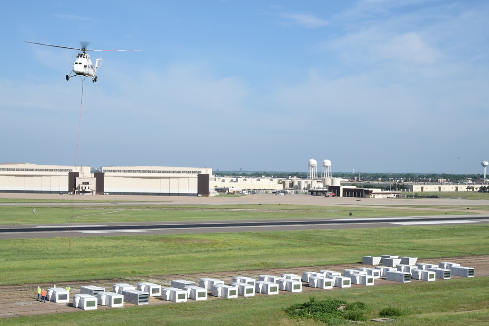 Helicopter moves 57 air conditioning units to roof of Bldg 3001.