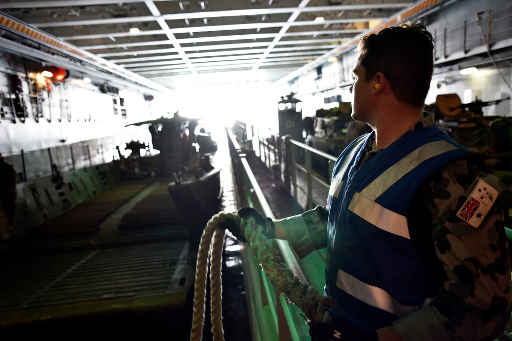 Australians move vehicles off ship