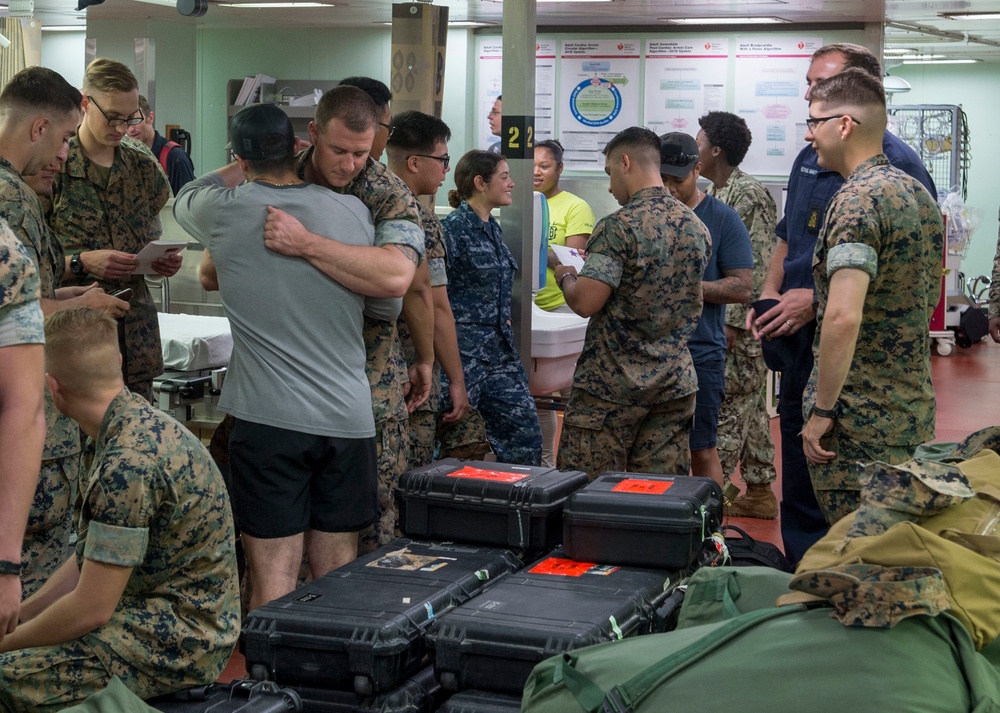 Service Members disembark USNS Mercy in Okinawa