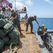 Service Members disembark USNS Mercy in Okinawa