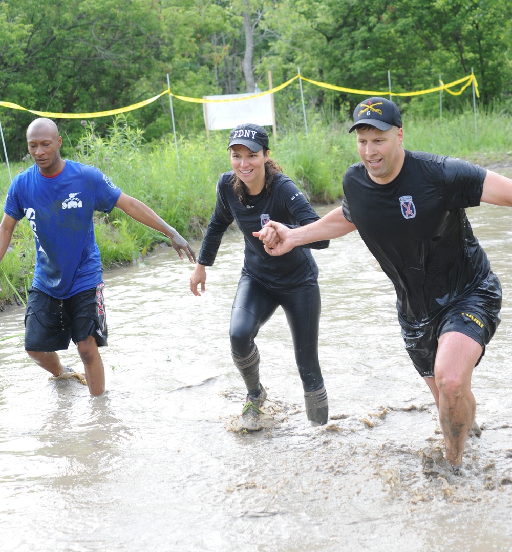 Through the muck and mire, 1,000 Fort Drum community members conquer the Mountain Mudder