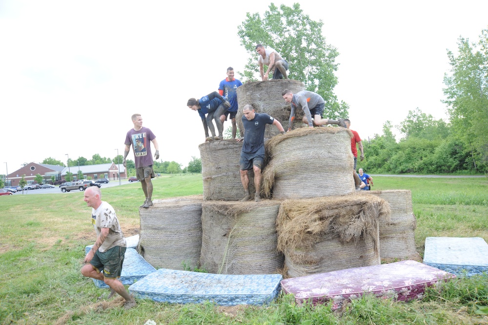 Through the muck and mire, 1,000 Fort Drum community members conquer the Mountain Mudder