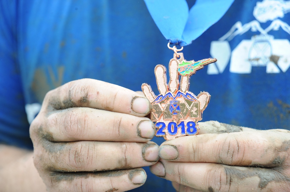 Through the muck and mire, 1,000 Fort Drum community members conquer the Mountain Mudder