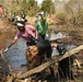 Volunteers remove trash from Shawsheen River