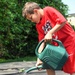 Volunteers, children spruce up Community Garden