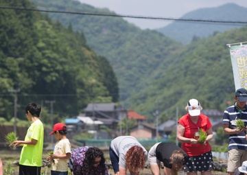 Station residents take to the fields, plant rice