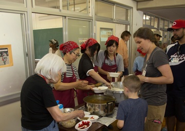 Station residents take to the fields, plant rice