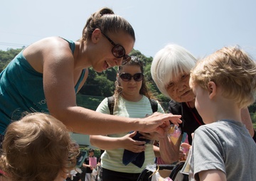 Station residents take to the fields, plant rice
