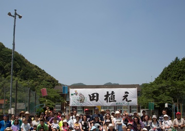 Station residents take to the fields, plant rice