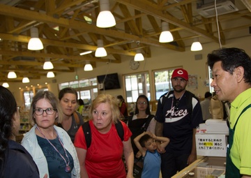 Station residents take to the fields, plant rice
