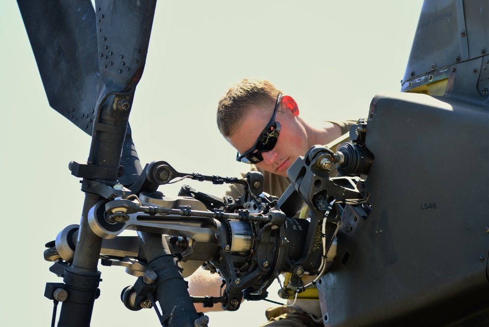 AH-64 Apache helicopter maintenance during Saber Strike 18