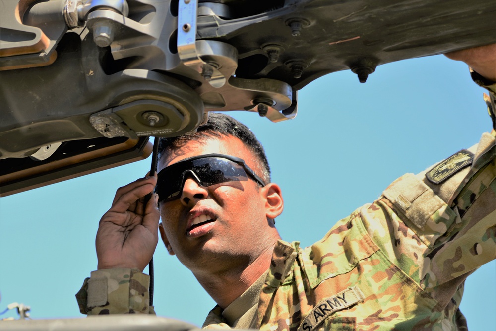 AH-64 Apache helicopter maintenance during Saber Strike 18