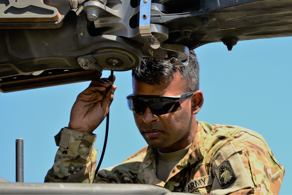 AH-64 Apache helicopter maintenance during Saber Strike 18