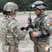 U.S. Army officer briefs a Romanian soldier on vehicle order