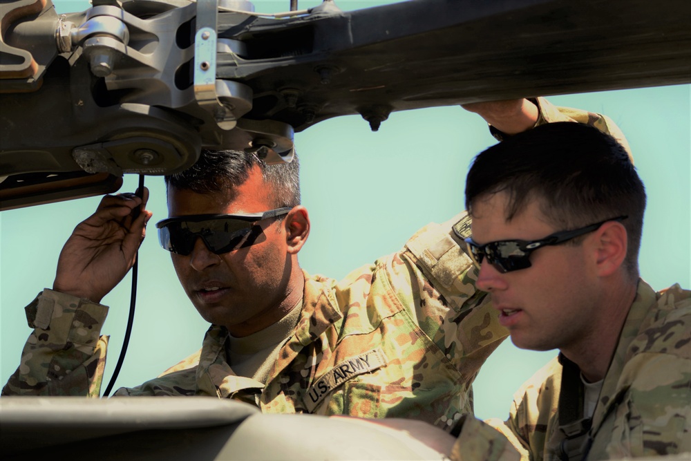 AH-64 Apache helicopter maintenance during Saber Strike 18