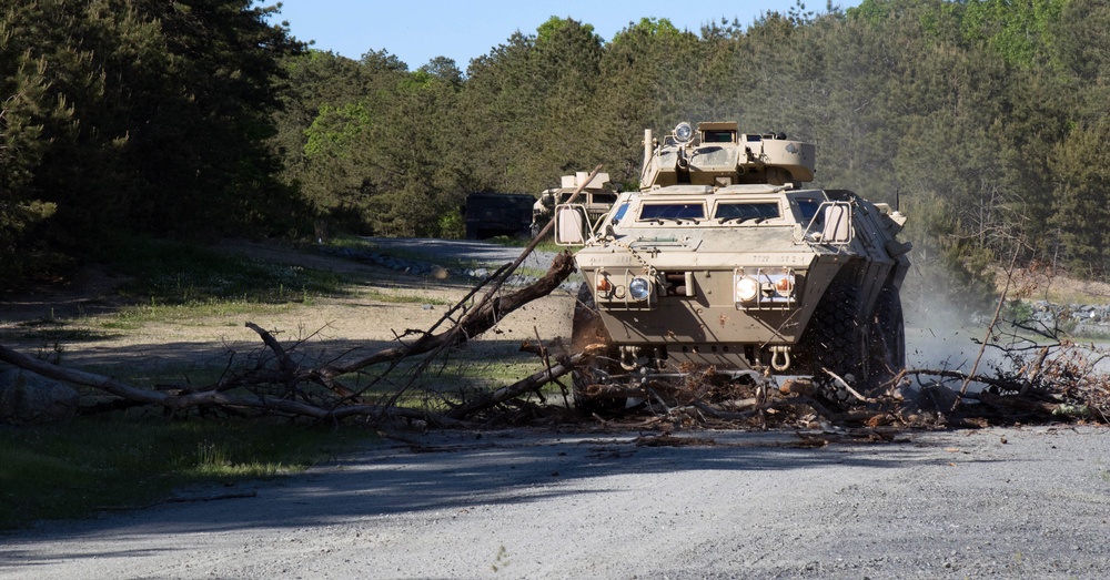Soldiers remove road block obstacle during during Combined Arms Exercise