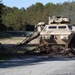 Soldiers remove road block obstacle during during Combined Arms Exercise