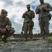 Soldier conducts mission brief at a sand table in Tactical Training Base Kelley