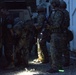 Soldiers search and secure a captured combatant during Combined Arms Exercise