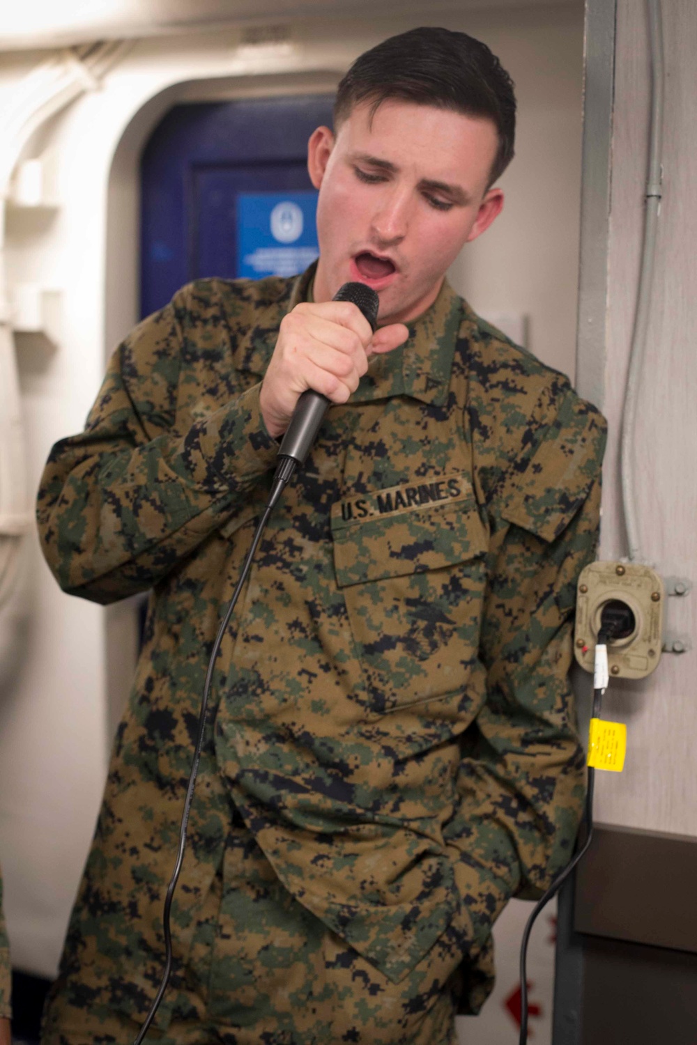 Marines and Sailors participate in karaoke and eat ice cream