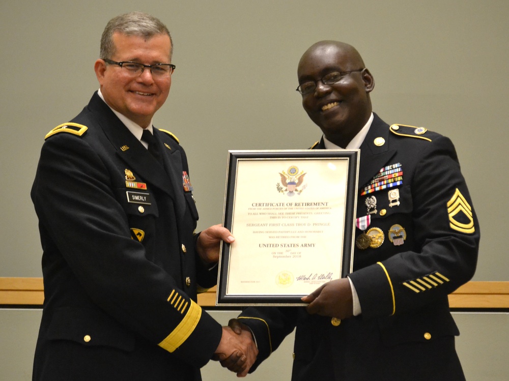 DLA Troop Support Commander Army Brig. Gen. Mark Simerly (left) poses with Army Sgt. 1st Class Troy Pringle after presenting his certificate of retirement June 1 in Philadelphia.