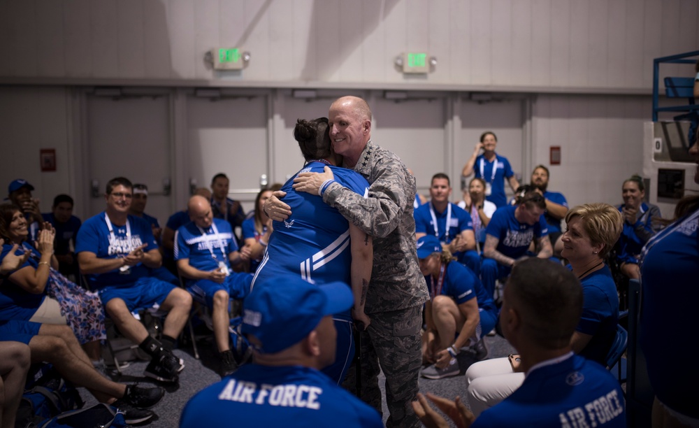 Gen. Stephen W. Wilson speaks with Team Air Force athletes