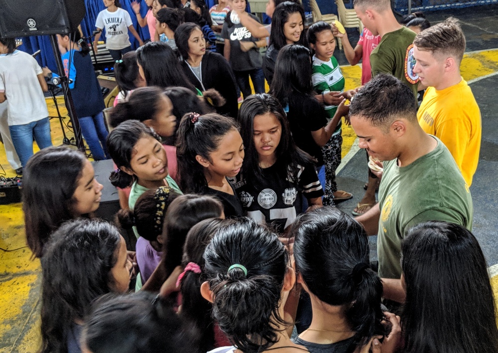 7th Fleet Sailors visit with students at Don Bosco Street Children Village in Manila