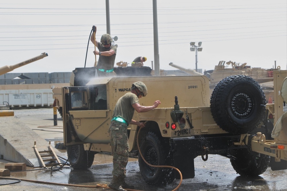HMMWV getting washed by Soldiers of Task Force Spartan