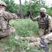 U.S. Army soldier provides aid to simulated injured soldier