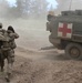 U.S. Army soldier helps simulated injury to medical evacuation