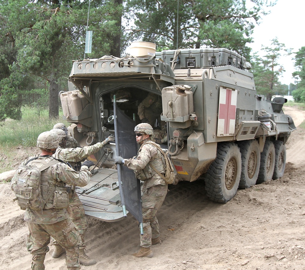 U.S. Army soldiers unload stretcher during Saber Strike 18