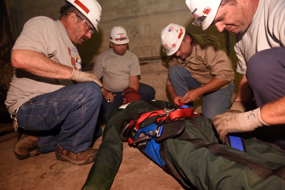 District dangles dummy to get smart on confined space safety