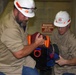 District dangles dummy to get smart on confined space safety