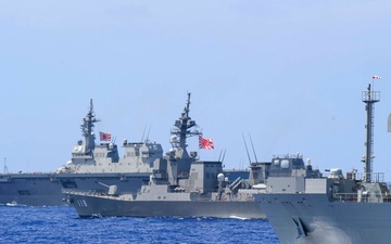 Ships from the Indian Navy and Japan Maritime Self-Defense Force (JMSDF) sail in formation during Malabar 2018