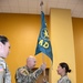 1st Lt. Maria Del Rio, incoming commander of the 200th Public Affairs Detachment, 93rd Troop Command, New Mexico Army National Guard, receives the unit's colors from the 93rd's commander.