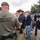 The image shows a gathering of federal law enforcement agents from multiple agencies, including CBP Border Patrol and HSI (Homeland Security Investigations). Agents are assembled outdoors, appearing to be in a briefing or staging formation. Faces have been blurred, likely for privacy or operational security purposes.