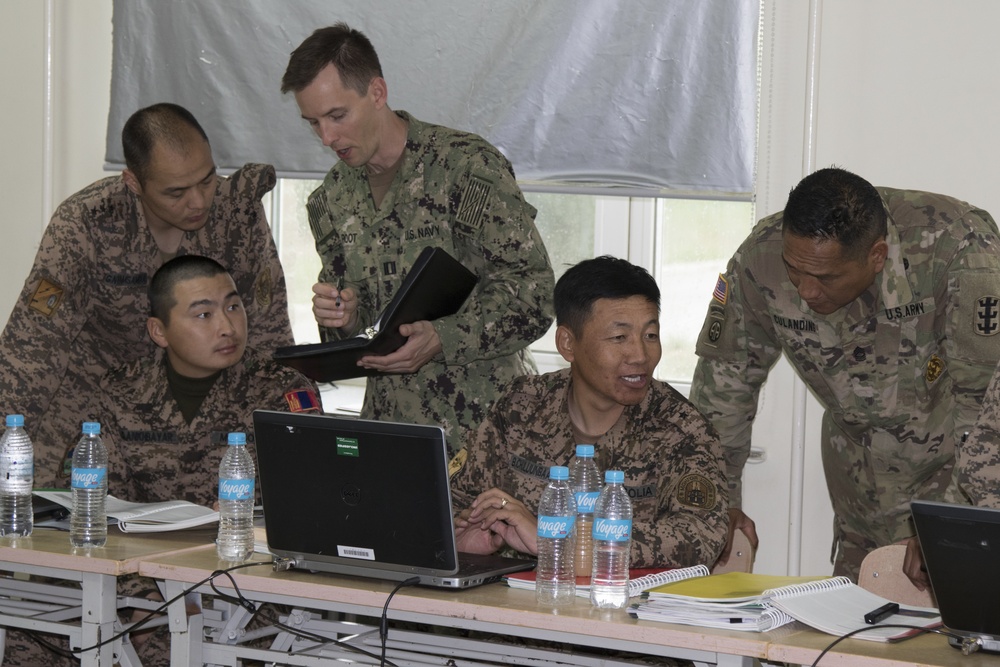 Peacekeepers from the U.S. Navy and Army work alongside their Mongolian Armed Force counterpart.