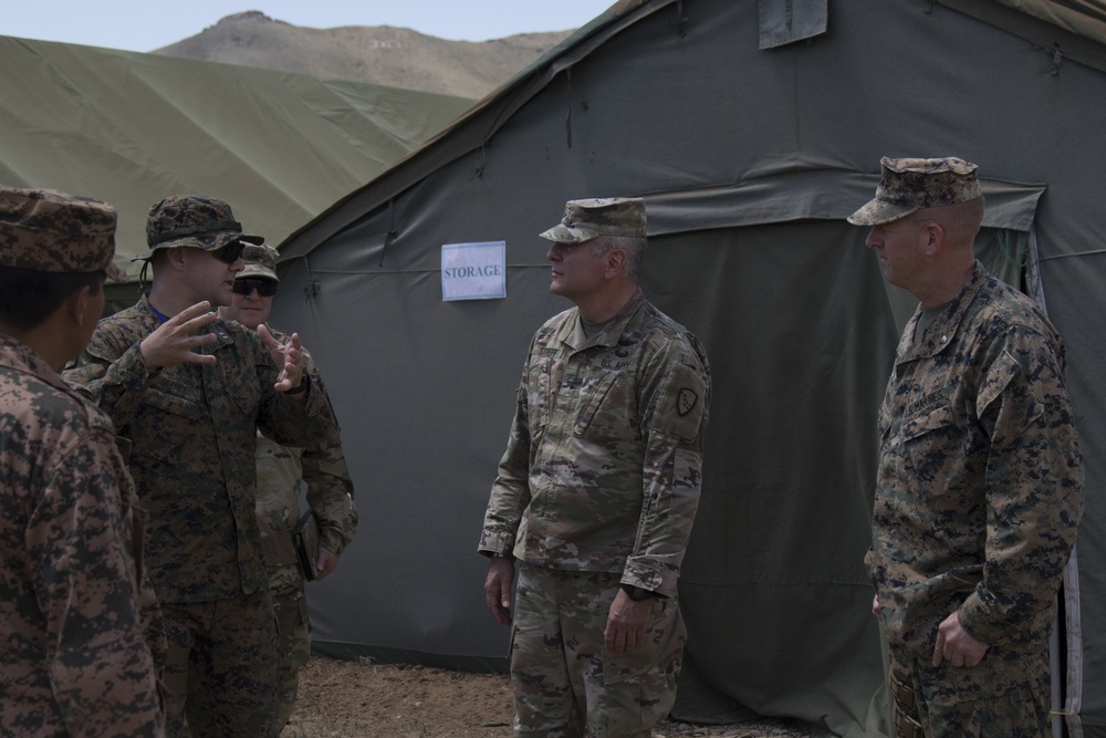 U.S. Army National Guard Brig. Gen. Joseph Streff, Alaska ARNG commander, converses with Marine Capt. Tate Blenke.