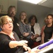 Members of the Greater Northeast Philadelphia Chamber of Commerce listen as Defense Logistics Agency Troop Support's Product Test Center Analytical supervisor Jamie Hieber provides a tour of the test center's shade room in Philadelphia June 18.