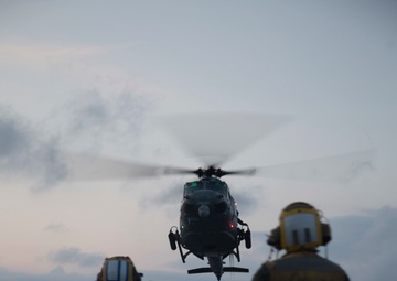 “Hueys” and “Cobras” land on the USS Arlington