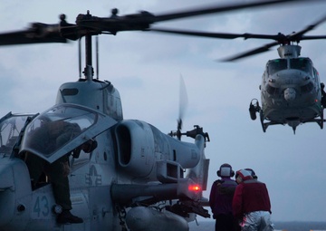 “Hueys” and “Cobras” land on the USS Arlington
