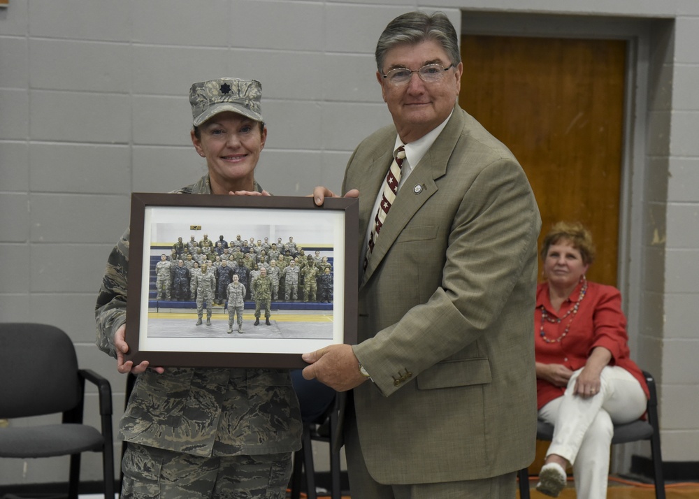 Judge Greg Norris presented with group photo of service members that assisted in the Alabama IRT at Monroeville site.